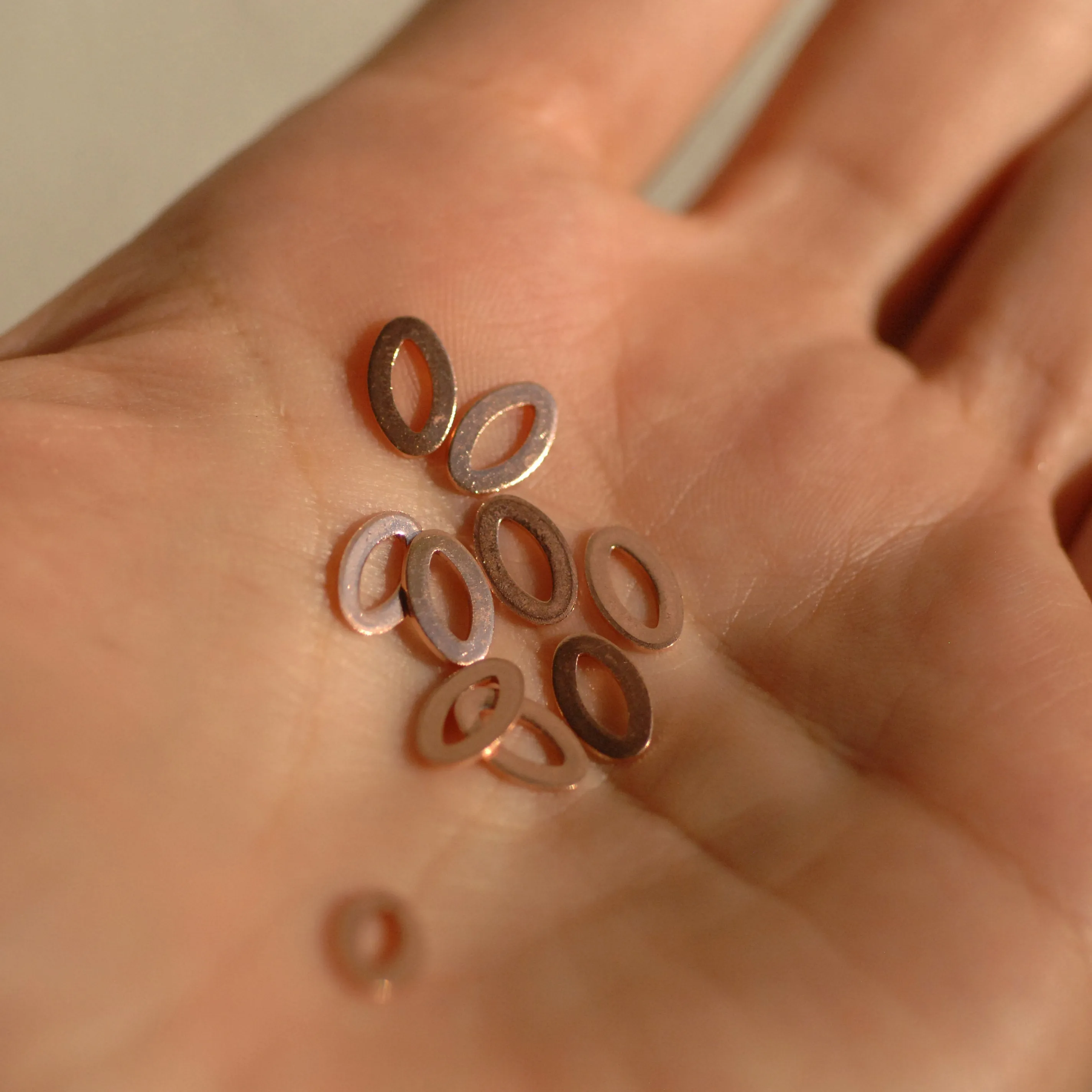 Tiny eye shaped donuts for making jewelry, earring charms, very small, copper, brass, bronze