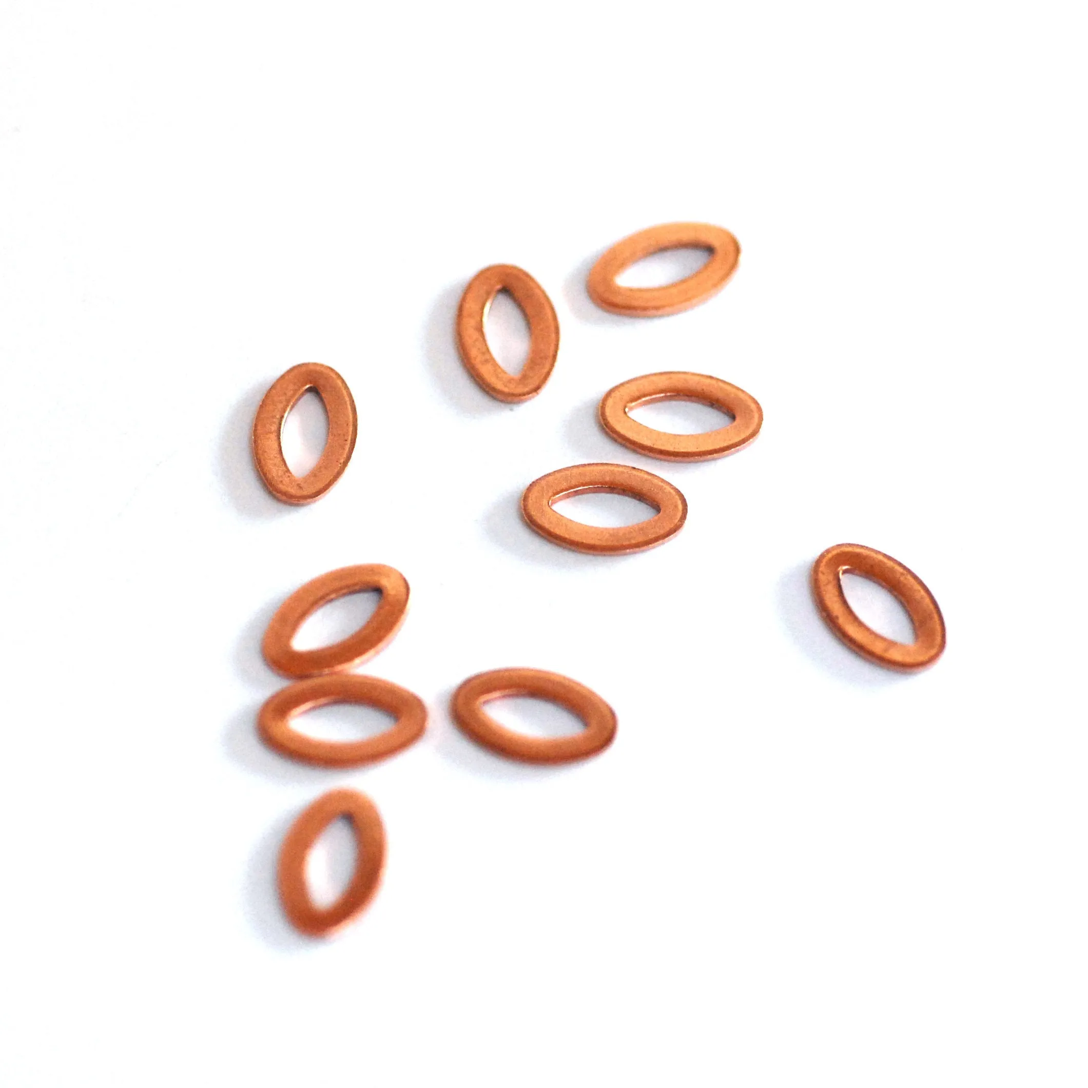 Tiny eye shaped donuts for making jewelry, earring charms, very small, copper, brass, bronze