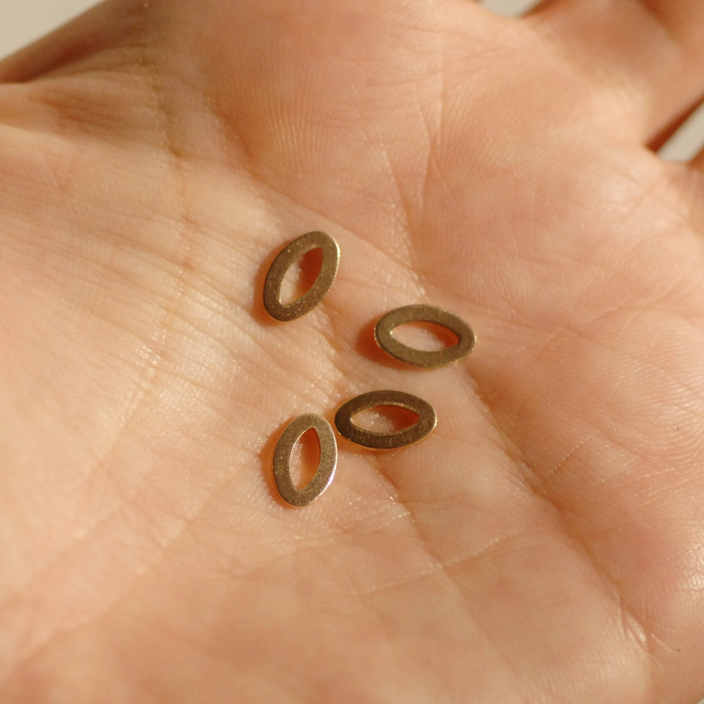 Tiny eye shaped donuts for making jewelry, earring charms, very small, copper, brass, bronze